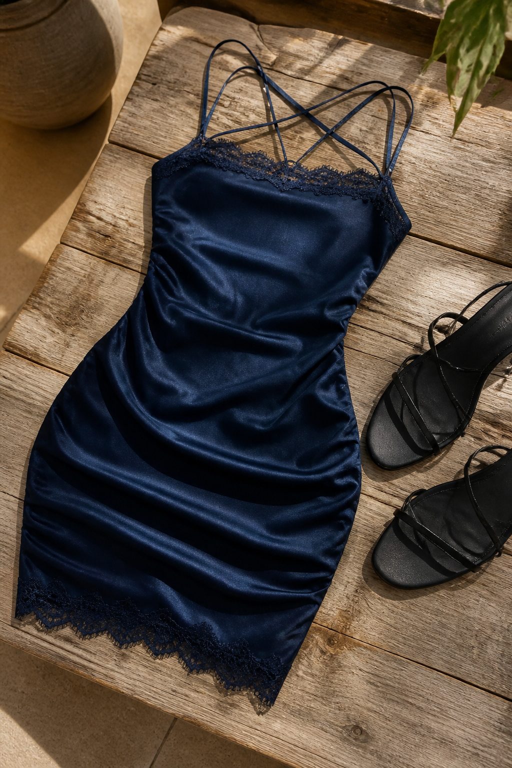 Close-up of a strappy square neck lace trim mini dress.