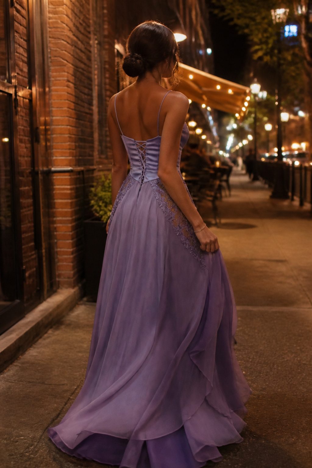 A prom dress featuring satin, chiffon, and lace materials.