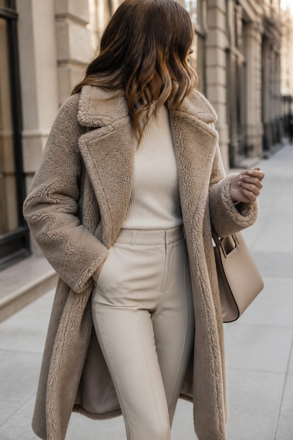 27 Winter Outfit Ideas for Women: 2026 Style Guide 13 Woman wearing a teddy coat in a winter setting.